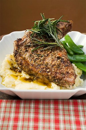 Spicy pork chop on mashed potato Fotografie stock - Premium Royalty-Free, Codice: 659-01859111