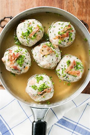 frying pan with bacon - Clear broth with bacon dumplings in frying pan Stock Photo - Premium Royalty-Free, Code: 659-01859149