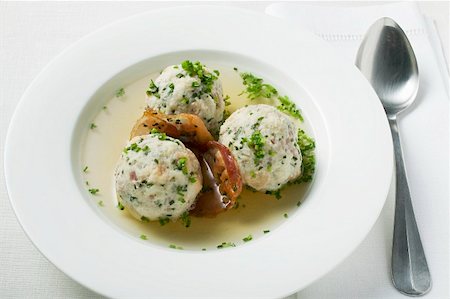 Clear broth with bacon dumplings in soup plate Stock Photo - Premium Royalty-Free, Code: 659-01859158