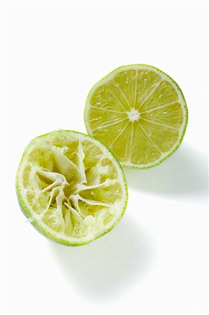 squeeze fruit - Two lime halves, one squeezed Stock Photo - Premium Royalty-Free, Code: 659-01859177