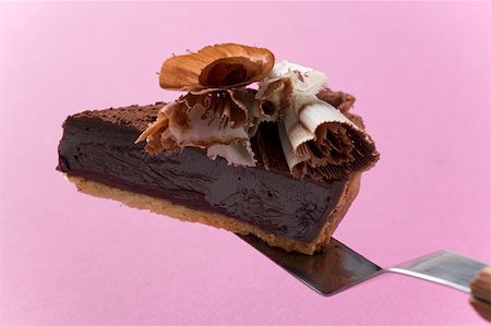 Morceau de tarte au chocolat sur le serveur de gâteau Photographie de stock - Premium Libres de Droits, Code: 659-01859302