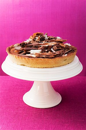 simsearch:659-03521015,k - Whole chocolate tart on cake stand Stock Photo - Premium Royalty-Free, Code: 659-01859349