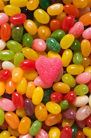 Coloured jelly beans and a pink sugar heart (full-frame) Fotografie stock - Premium Royalty-Free, Codice: 659-01859628