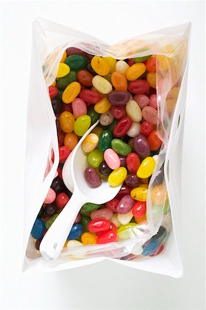 simsearch:659-01860374,k - Coloured jelly beans in plastic bag with scoop (overhead view) Stock Photo - Premium Royalty-Free, Code: 659-01859681