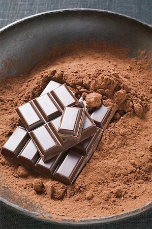 Cocoa powder and pieces of chocolate in bowl Stock Photo - Premium Royalty-Free, Code: 659-01859764