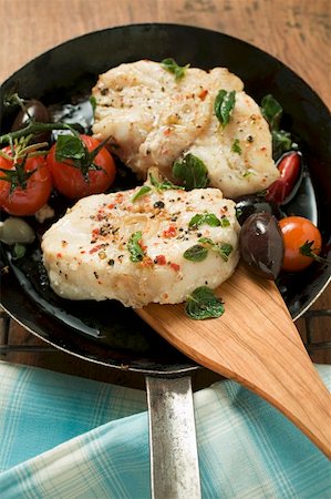 fried cherry tomatoes - Monkfish cutlets with cherry tomatoes & olives in frying pan Stock Photo - Premium Royalty-Free, Code: 659-01859863