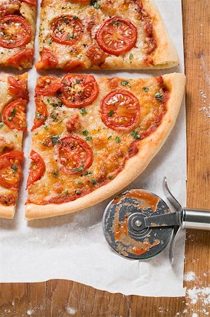 recipes paper - Cheese and tomato pizza with oregano (quartered) Stock Photo - Premium Royalty-Free, Code: 659-01859959