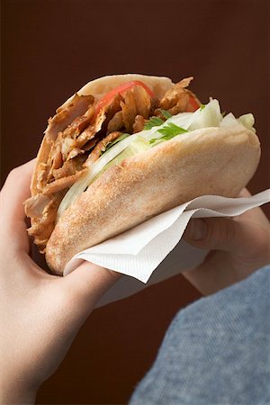 doner kebab recipe - Hands holding a döner kebab Stock Photo - Premium Royalty-Free, Code: 659-01850106