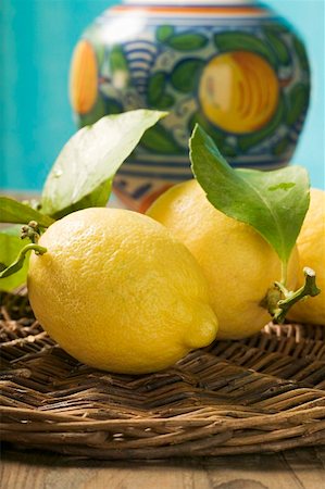 simsearch:659-01857464,k - Fresh lemons with leaves on wicker tray Stock Photo - Premium Royalty-Free, Code: 659-01850102