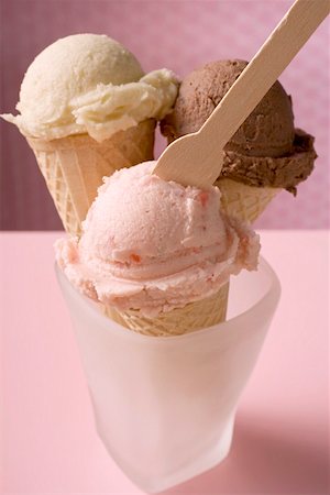 photo three ice creams - Strawberry, chocolate & vanilla ice cream in cones, ice cream spoon Stock Photo - Premium Royalty-Free, Code: 659-01850230