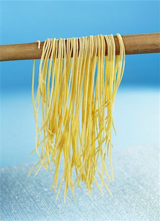 simsearch:659-01850098,k - Home-made pasta hanging up to dry Stock Photo - Premium Royalty-Free, Code: 659-01850340