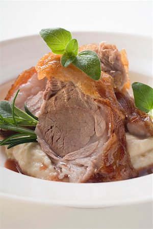 A slice of roast shoulder of lamb with crisp fat Stock Photo - Premium Royalty-Free, Code: 659-01850949