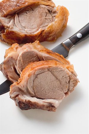 simsearch:659-01846214,k - Roast shoulder of lamb being sliced Stock Photo - Premium Royalty-Free, Code: 659-01850951