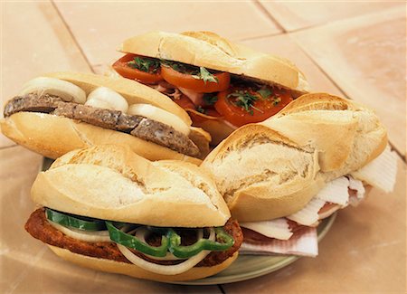 different bread rolls - Bocadillos (baguette rolls) with various fillings Stock Photo - Premium Royalty-Free, Code: 659-01851152