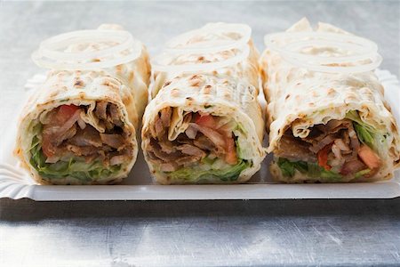 doner kebab recipe - Three Turkish döner wraps Stock Photo - Premium Royalty-Free, Code: 659-01851204