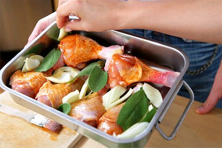 Marinated chicken thighs with sage and fennel (still raw) Stock Photo - Premium Royalty-Free, Code: 659-01851547