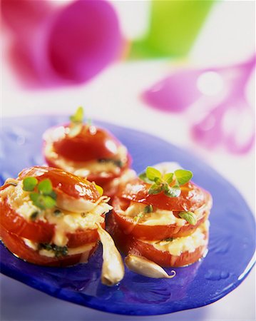Tomatoes with mozzarella and garlic stuffing Stock Photo - Premium Royalty-Free, Code: 659-01851691