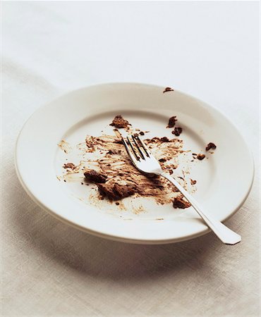 Plate with remains of chocolate mousse Stock Photo - Premium Royalty-Free, Code: 659-01851800