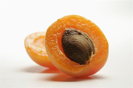 Half an apricot Stock Photo - Premium Royalty-Free, Code: 659-01852017