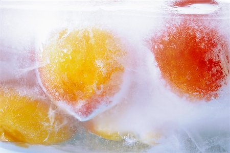 Frozen peaches in a block of ice Stock Photo - Premium Royalty-Free, Code: 659-01852100