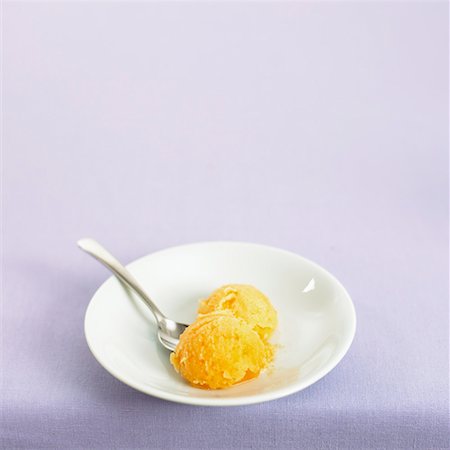 sherbet - Two scoops of orange sorbet on a plate Stock Photo - Premium Royalty-Free, Code: 659-01852132