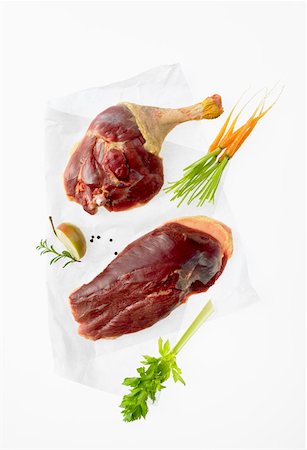 poultry type - Various goose pieces lying on greaseproof paper Stock Photo - Premium Royalty-Free, Code: 659-01852177