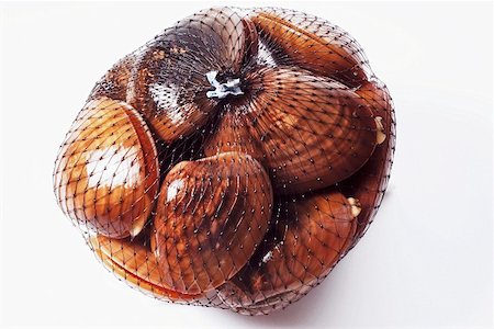 shellfish type - Clams packed in a net, ready to sell Stock Photo - Premium Royalty-Free, Code: 659-01852324
