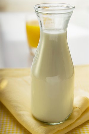 Carafe of milk on a fabric napkin Stock Photo - Premium Royalty-Free, Code: 659-01852442