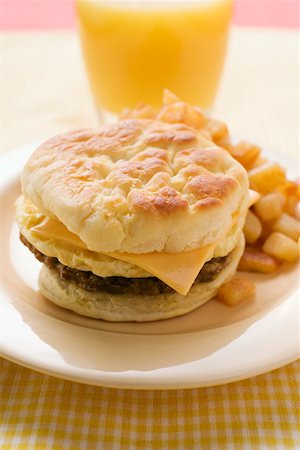 scrambled - Cheeseburger with scrambled egg and fried potatoes Stock Photo - Premium Royalty-Free, Code: 659-01852515