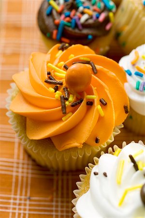 Colourful decorated muffins Stock Photo - Premium Royalty-Free, Code: 659-01852576