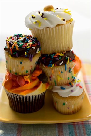 A pile of colourful decorated muffins Stock Photo - Premium Royalty-Free, Code: 659-01852584