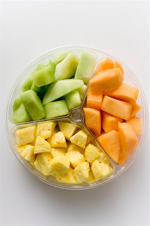 fruits salad in a container - Pieces of fruit in a plastic bowl Stock Photo - Premium Royalty-Free, Code: 659-01852594