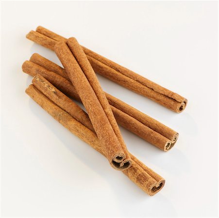 Four cinnamon sticks on white background Stock Photo - Premium Royalty-Free, Code: 659-01852755