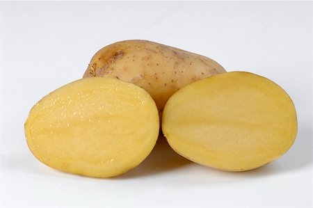 simsearch:659-06185929,k - A whole potato and two potato halves Stock Photo - Premium Royalty-Free, Code: 659-01852832