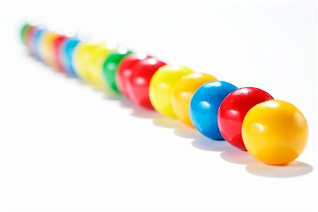 A row of coloured chewing gum balls Foto de stock - Sin royalties Premium, Código: 659-01853110