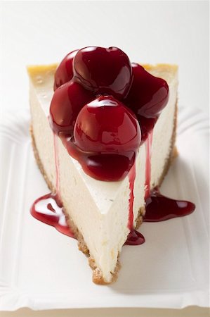 A piece of cheesecake with cherry sauce Stock Photo - Premium Royalty-Free, Code: 659-01853741