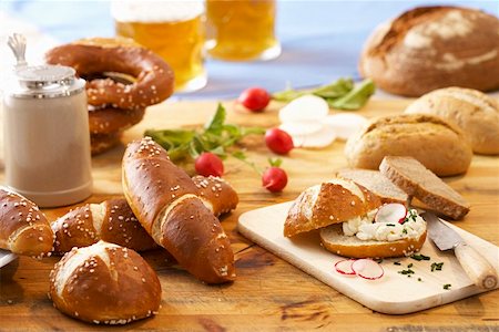 Still life with bread, rolls, beer and radishes Stock Photo - Premium Royalty-Free, Code: 659-01853948