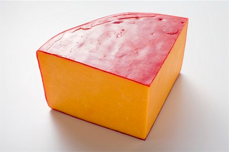 Wedge of Cheddar cheese Stock Photo - Premium Royalty-Free, Code: 659-01864061