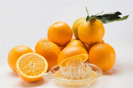simsearch:659-03525022,k - Juice oranges with citrus squeezer Stock Photo - Premium Royalty-Free, Code: 659-01864185