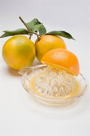 pressed juice - Squeezing an orange Stock Photo - Premium Royalty-Free, Code: 659-01864188