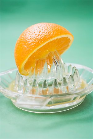 picture squeezing oranges - Squeezing an orange Stock Photo - Premium Royalty-Free, Code: 659-01864212