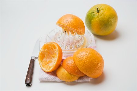 pressed juice - Squeezing oranges Stock Photo - Premium Royalty-Free, Code: 659-01864227