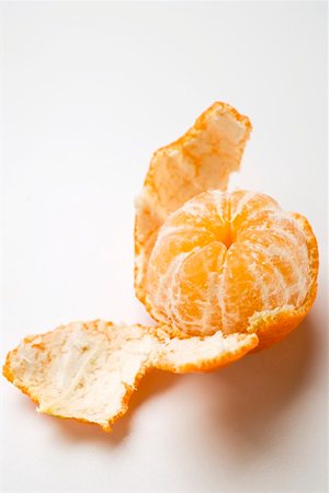 Peeled clementine Fotografie stock - Premium Royalty-Free, Codice: 659-01864240