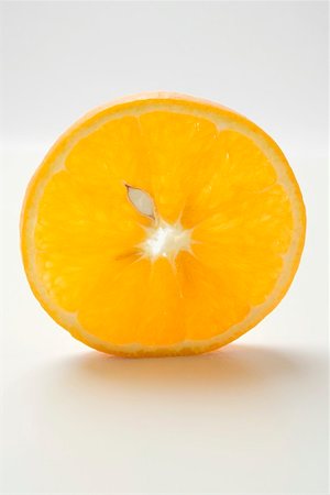 set up - Slice of orange, standing on its edge Stock Photo - Premium Royalty-Free, Code: 659-01864243