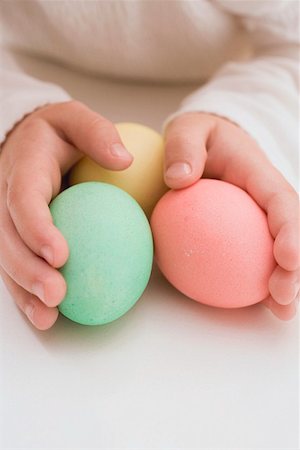 simsearch:659-01850865,k - Child's hands holding three coloured eggs Stock Photo - Premium Royalty-Free, Code: 659-01864313