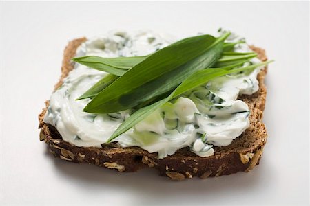 simsearch:659-03528790,k - Quark and ramsons (wild garlic) on wholemeal bread Stock Photo - Premium Royalty-Free, Code: 659-01864604