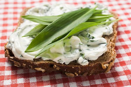 simsearch:659-03528790,k - Quark and ramsons (wild garlic) on wholemeal bread Stock Photo - Premium Royalty-Free, Code: 659-01864605