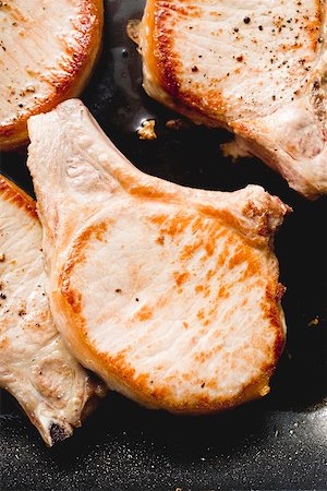 pork chops not raw - Fried pork chops Stock Photo - Premium Royalty-Free, Code: 659-01864674