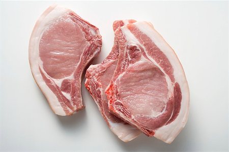 simsearch:659-01867477,k - Three raw pork chops Stock Photo - Premium Royalty-Free, Code: 659-01864671