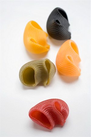 simsearch:659-01864821,k - Coloured lumaconi (pasta shells) from above Fotografie stock - Premium Royalty-Free, Codice: 659-01864786